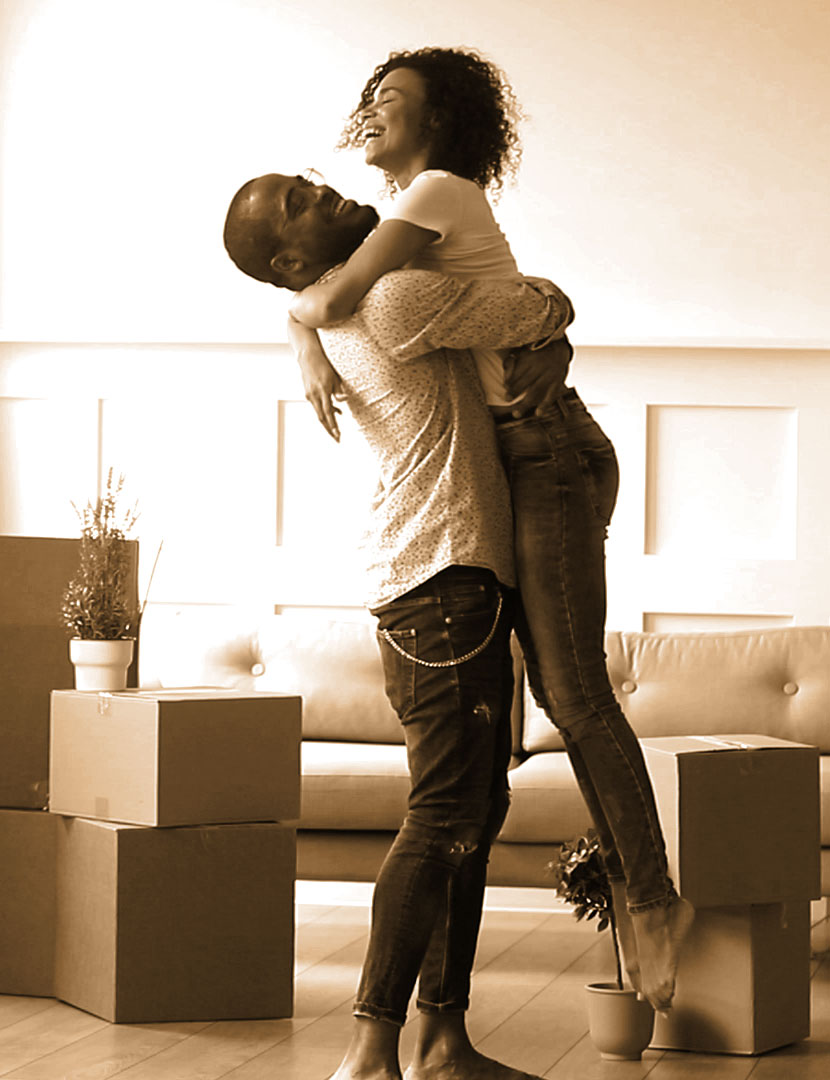 Couple hugging in their home